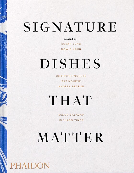 The cover of the book "Signature Dishes That Matter," curated by Susan Jung, Howie Kahn, Christine Muhlke, Pat Nourse, Andrea Petrini, Diego Salazar, and Richard Vines. The book is published by Phaidon.