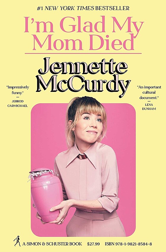 The cover of the book "I'm Glad My Mom Died" by Jennette McCurdy features a woman in a pink outfit holding a pink urn. The cover includes quotes praising the book and a label indicating it as a #1 New York Times Bestseller. The price and ISBN are listed at the bottom.