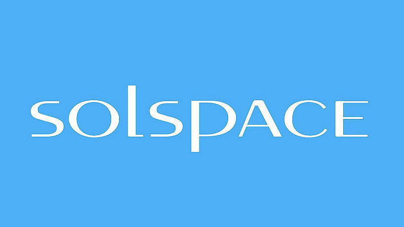 The image displays the word "solspace" in white text against a blue background. The font is sans-serif with a modern, clean design. The letter "L" and the end of the "S" extend below the baseline, adding a distinctive touch to the logo.