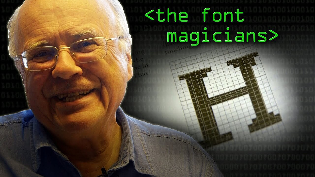 An older man with white hair and glasses smiles while wearing a blue shirt. To his right, the words "<the font magicians>" appear in green, and a grid-like letter "H" is displayed against a partially visible background of binary code.