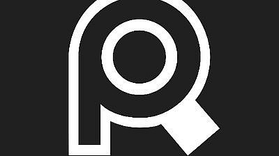 A white stylized magnifying glass forming the letter "P" on a black background. The handle of the magnifying glass points downward and to the right, creating the leg of the letter "P.