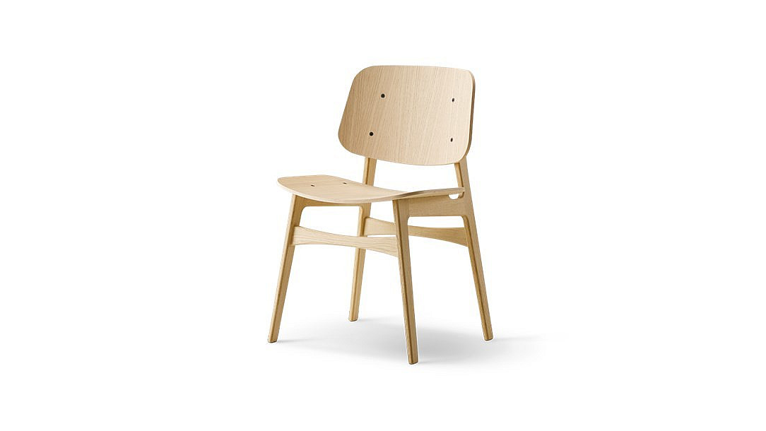 A wooden chair with a simple, minimalist design. The chair features a square backrest and seat, both made of light-colored wood with visible grain patterns. It has four legs and no armrests. The chair is photographed against a white background.
